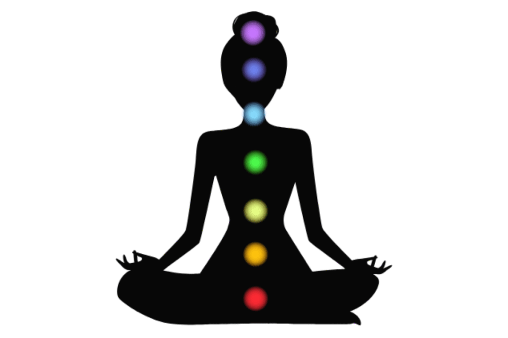 人のシルエットに7色の光が重なり、チャクラの位置をやわらかく示す幻想的なイメージ